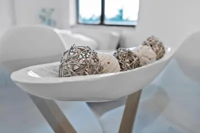 a white bowl of ice cream on a table at Hollywood Beachfront Apartment in Hollywood