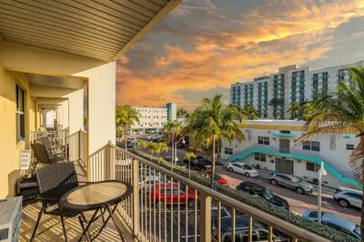 a balcony with a view of a city at Hollywood Beachfront Apartment in Hollywood
