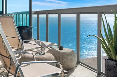 a balcony with chairs and a view of the ocean at THE SETAI 5 STARS HOTEL-RESIDENCE MIAMI BEACH OCEANVIEW 2 Bedroom UNIQUE in Miami Beach
