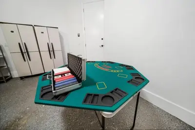 a table with books on it in a room at Modern RocknHome Near Hard Rock and FLL Airport in Fort Lauderdale