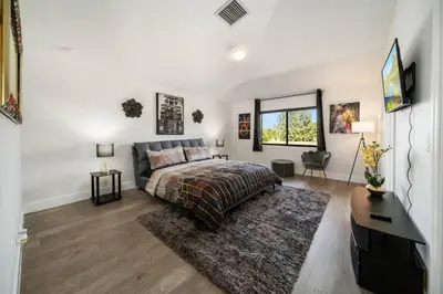 a bedroom with a bed and a desk at Modern RocknHome Near Hard Rock and FLL Airport in Fort Lauderdale