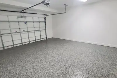 an empty room with white walls and concrete floors at Botanical Oasis Home with 2 Pools in Fort Lauderdale