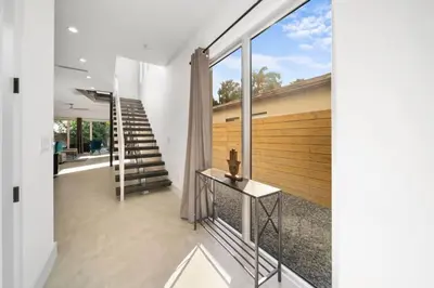 a view from the hallway of a house with a staircase at Las Olas Zen Home with Pool and Hot Tub Near Beach in Fort Lauderdale