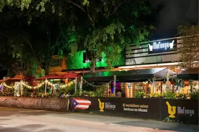 a restaurant with green lights in front of it at Cozy Little Havana Apt Centrally located Hv2 in Miami