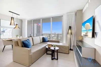 a living room with a couch and a table at Luxury 1 Br Front Intracoastal View Balcony Pools in Hollywood