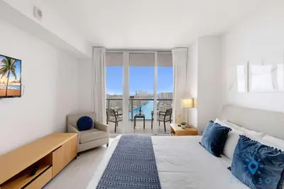 a bedroom with a bed and a view of the ocean at Beachwalk Resort - Pool - Gym - Amazing view in Hallandale Beach
