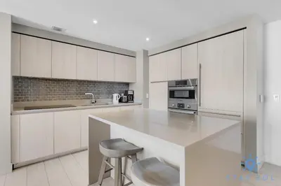 a kitchen with white cabinets and a white counter top at Oceanfront Balcony Enjoy Endless Views Hot Tub in Hollywood