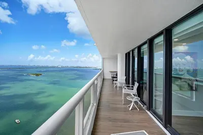a balcony with a view of the ocean at The Bond - OO7 Vibes and Penthouse Water Views! in Miami