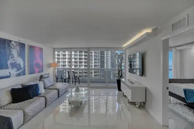 a living room with a couch and a table at Elevate! Water and Park Views in Miami