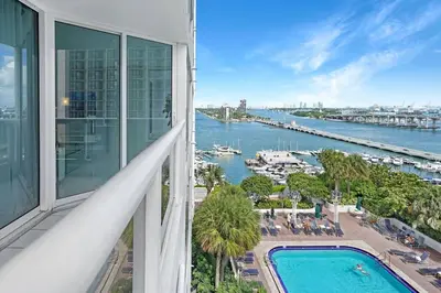 a view of a river from a building with a pool at Life Is Gucci! Gorgeous WATER VIEWS Miami Condo! in Miami