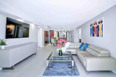 a living room with a couch and a table at Summer Retreat! Water and City Views! in Miami
