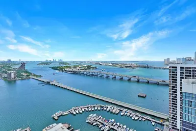 an aerial view of a river with a marina at Spectacular! Penthouse with Direct Water Views! in Miami