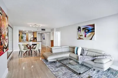 a living room with a couch and a table at Day Dreamer! Water & Miami City Views! in Miami