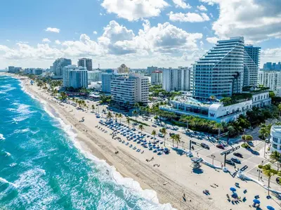 an aerial view of a beach with buildings and the ocean at Oceanview Luxury, Resort Access, Sleeps 6 2BR 2BA - Vista Mar by HomeStakes Stays in Fort Lauderdale
