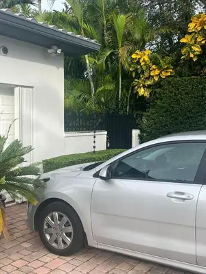 a white car parked in front of a house at VILLA GUILLA in Miami