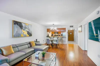 a living room with a couch and a table at Modern Bayview Apartment in Brickell Bay in Miami