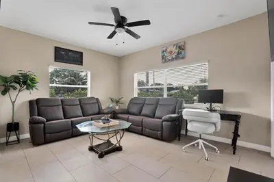 a living room with a couch and a table at Home away from home in Hollywood