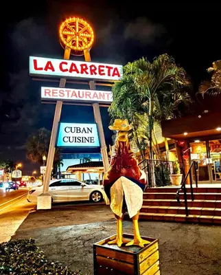 a statue of a woman sitting on a box in front of a restaurant at Cute Private Room, near the Airport - Free parking - 02 in Miami