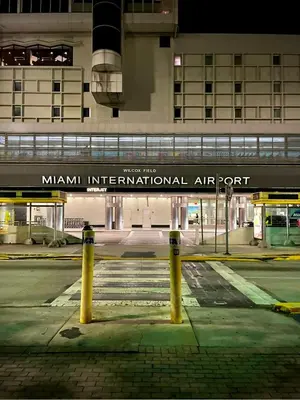 a sign for aiman international air port in front of a building at Cozy Private House near Miami Airport - Free parking - 02 in Miami
