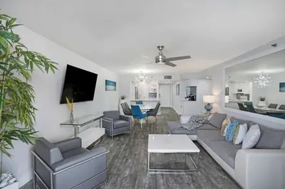 a living room with a couch and a table at Miami Vice! Totally Renovated, Water & Park Views! in Miami