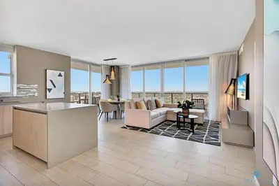 a living room with a couch and a table at High Floor with Stunning View Pools Near Beach in Hollywood