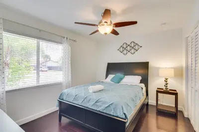 a bedroom with a bed and a ceiling fan at Pet-Friendly Miami Home with Hot Tub and Pool Table in Miami