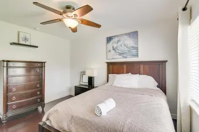a bedroom with a bed with a ceiling fan at Pet-Friendly Miami Home with Hot Tub and Pool Table in Miami