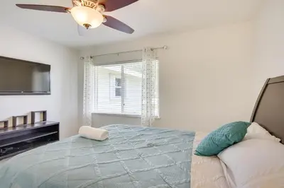 a bedroom with a bed and a ceiling fan at Pet-Friendly Miami Home with Hot Tub and Pool Table in Miami