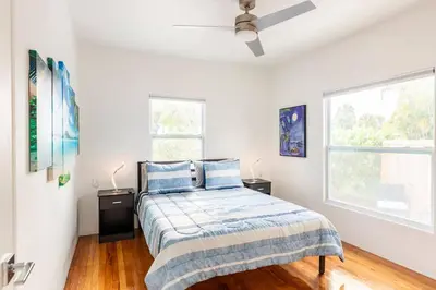 a bedroom with a bed and a ceiling fan at Blue Ocean Vacation Home 2 in Fort Lauderdale
