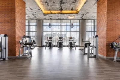 a gym with a row of chairs in a room with windows at 23rd-Floor Views • Pool Gym Beach Service in Hollywood