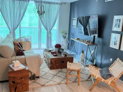 a living room with a couch and chairs at LUX RENTALS - Brickell Unit in Miami