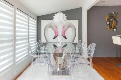 a dining room with a glass table and chairs at Blue Ocean Vacation Home 1 in Fort Lauderdale