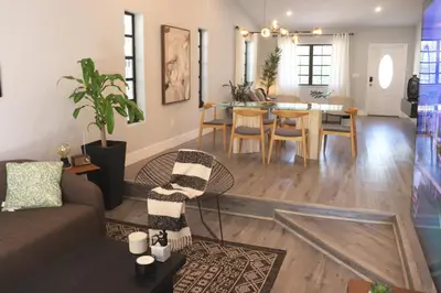a living room with a couch and a table at Zoka House 5 mints from Brickell in Miami