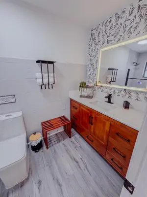 a bathroom with a sink and a toilet and a mirror at Zoka House 5 mints from Brickell in Miami