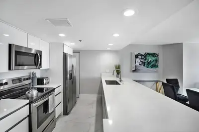 a kitchen with a white counter top and appliances at Higher Love! Water Views and Cool Vibes in Miami