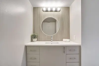 a bathroom with a sink and a mirror at Stay in Love! Miami Skyline Views, Renovated in Miami