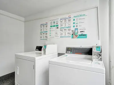 a white laundry room with a washer and dryer at Modern Ocean View Condo Beach Service Unit 1206 in Miami Beach