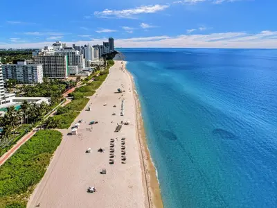 an aerial view of a beach and the ocean at Ocean View condo w beach service 411 in Miami Beach
