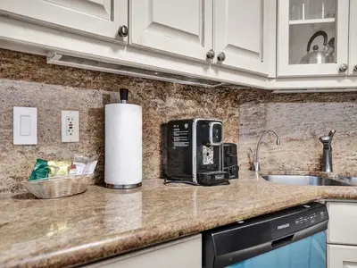 a kitchen counter with a toaster and a sink at Ocean View Condo Beach Service 1504 in Miami Beach