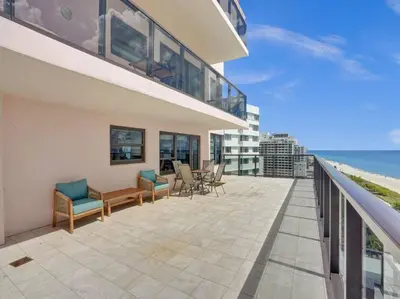 a balcony of a house with a view of the ocean at Huge Terrace Oceanfront Condo Beach Service 1502 in Miami Beach