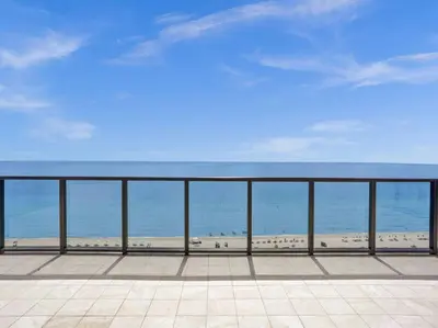 a view of the beach from a balcony at Huge Terrace Oceanfront Condo Beach Service 1502 in Miami Beach