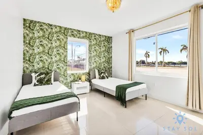 a bedroom with two beds and a window at Free Parking - Bay View - Pool -Step To Beach in Hollywood