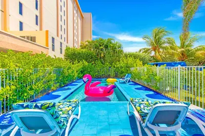 a pool with a pink rubber duck in the middle at Free Parking - Bay View - Pool -Step To Beach in Hollywood