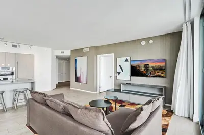 a living room with a couch and a table at 2BR & 2BA Corner Suite Ocean Views at Hyde Beach House in Hollywood
