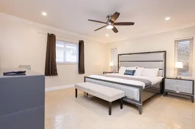 a bedroom with a bed and a ceiling fan at Ultimate Luxury 5BR Villa near Hollywood Beach in Hollywood