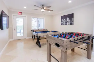a room with two ping pong tables in it at Ultimate Luxury 5BR Villa near Hollywood Beach in Hollywood