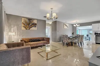 a living room with a couch and a table at Luxury 3bd/2ba near Beach & Las Olas in Fort Lauderdale