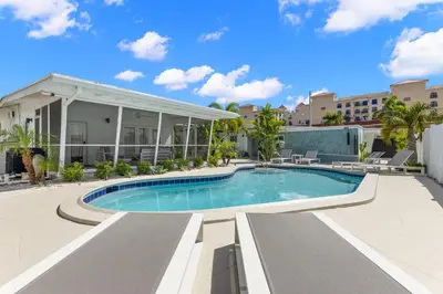 an image of a swimming pool at a resort at Coconut Walk To The BeachComfy Beds Firepit Pool in Fort Lauderdale