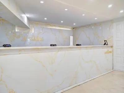 a bar in a room with a marble wall at Amazing Ocean View Condo Beach Service 1111 in Miami Beach