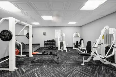 a gym with treadmills and machines in a room at High Floor Beachfront Condo Beach Service 1509 in Miami Beach